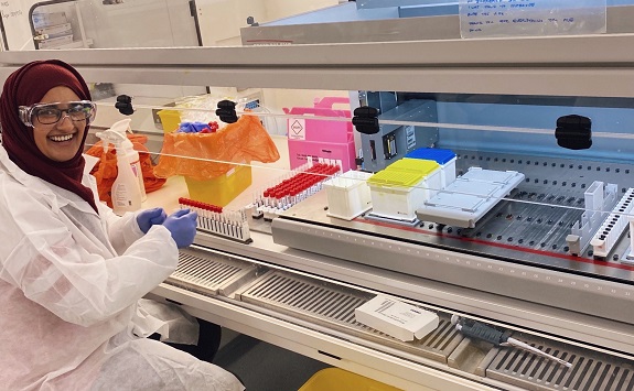 A student working at a fume hood 